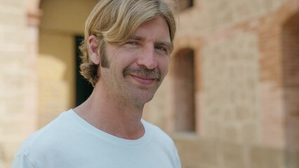 Sticker - Young blond man smiling confident standing at street