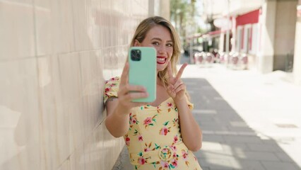 Sticker - Young beautiful hispanic woman smiling confident making selfie by the smartphone at street