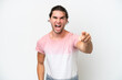 © luismolinero - Caucasian handsome man isolated on white background frustrated and pointing to the front