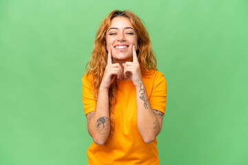 Young caucasian woman isolated on green screen chroma key background smiling with a happy and pleasant expression