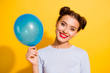 Canvas Print - Photo of funny adorable girl dressed white shirt rising blue balloon isolated yellow color background