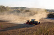 © wernerimages - tractor plowing a brown dusty field