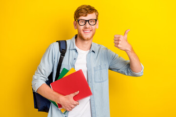 Photo of positive smart clever boy arm show good feedback symbol offer use quality eyewear empty space isolated on yellow color background