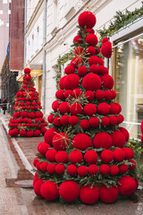 Christmas decoration of the city. Christmas tree with big red balls