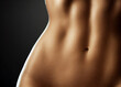 Torso of slim attractive female with flat belly ski
