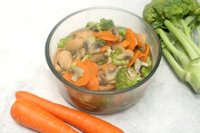 Ceramic Bowl Of Vegetable Soup. Vegetable Soup With Carrots, Broccoli, Mushroom, And Souses 
