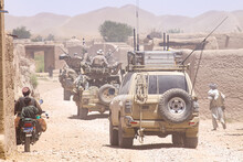 Military Patrol Convoy In The Village