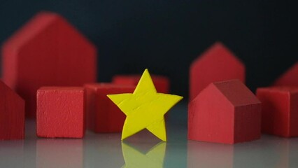 Poster - Give wood yellow star to red home. The concept of estimating and rate a house