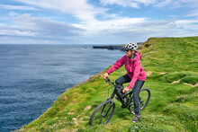 Nice Senior Woman On Mountain Bike, Cycling On The Cliffs Of Cnoc An Daimh, Kilgalligan The Northern Part Of The Republic Of Ireland