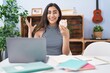 © Krakenimages.com - Young teenager girl studying using computer laptop celebrating victory with happy smile and winner expression with raised hands