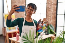 Young Beautiful Hispanic Woman Artist Smiling Confident Make Selfie By Smartphone At Art Studio