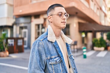 Sticker - Young hispanic man looking to the side with relaxed expression at street