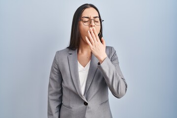 Sticker - Hispanic business woman wearing glasses bored yawning tired covering mouth with hand. restless and sleepiness.