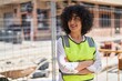© Krakenimages.com - Young middle east woman architect standing with arms crossed gesture at street