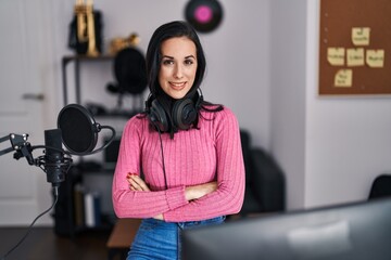 Sticker - Young caucasian woman musician smiling confident standing with arms crossed gesture at music studio