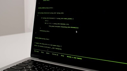 Wall Mural - developer is browsing html code on the computer screen. scroll of html web page code. programming co