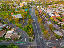 Aerial View Of Roads, Intersections And Railway Lines Through An Inner City Suburb