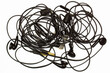 Old tangled headphones on a white background. Isolated. Black dusty dirty wired headphones with tangled wires. Audio Speakers, microphones, plugs and volume controls. Built-in vacuum music headset.