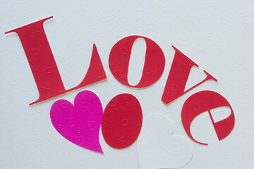 Sticker - background with the word love with hearts and oval