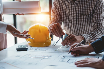 Architect or engineers are meeting to discuss home design. modify plans build a construction project and modify the work according to the needs of the customer.