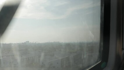 Canvas Print - outside view while riding airpiort rail link skytrain with local landscape view of bangkok in sunset time