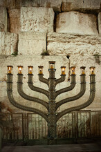 The Official Hanukkah Menorah Of The Western Wall In Jerusalem, Alight With All Eight Candles Burning On The Final Night Of The Eight-day Festival.