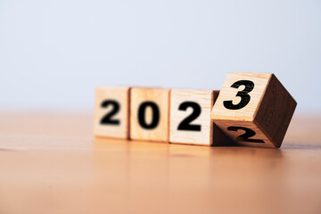 Wall Mural - flipping of wooden block cube to change 2022 to 2023 for merry christmas and happy new year preparat