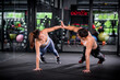© APchanel - Portrait young fitness woman under push up exercise at gym. she exercise for strong ,make muscle body building and good healthy concept