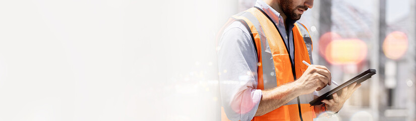 Portrait of handsome successful architect standing with arms crossed in building in construction process banner.