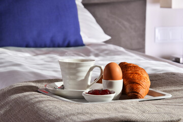 Wall Mural - Breakfast on tray in bed in hotel room