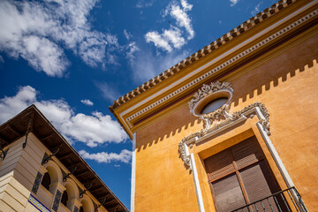 Wall Mural - Colorful facades of the old town of Mula, in Murcia, Spain with the intense blue sky in the background