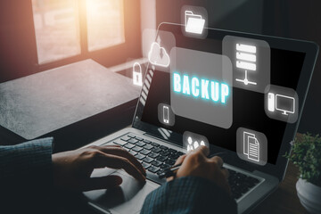 Backup storage data internet technology business concept, Business woman using a computer with VR screen backup icon on desk.