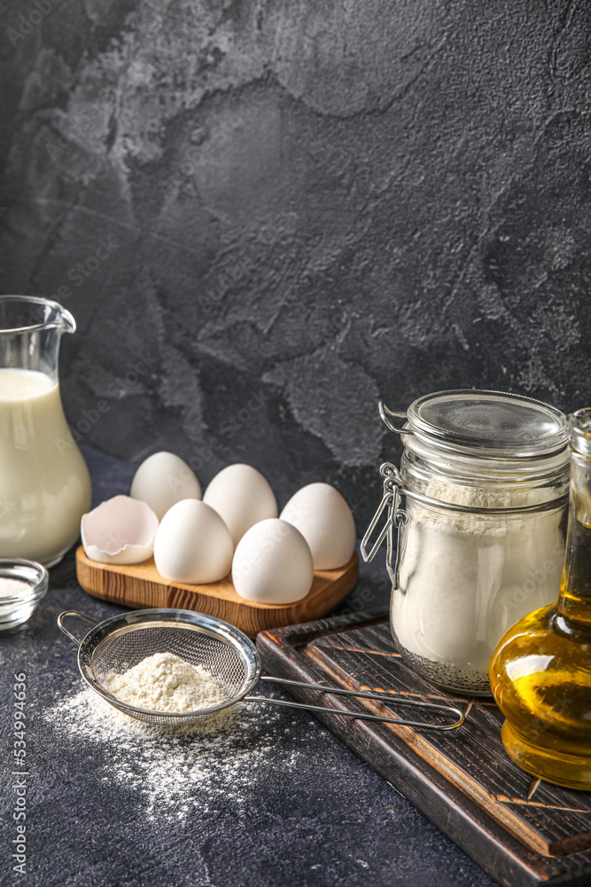Ingredients for baking on dark table