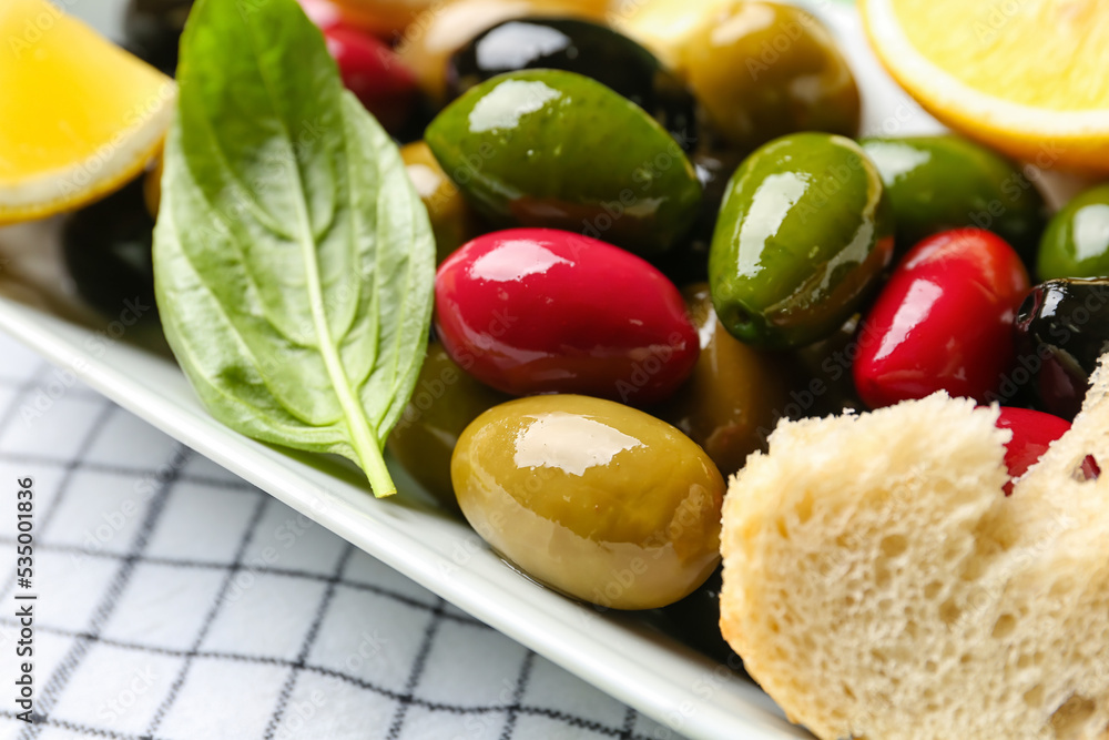 Plate with delicious olives, closeup