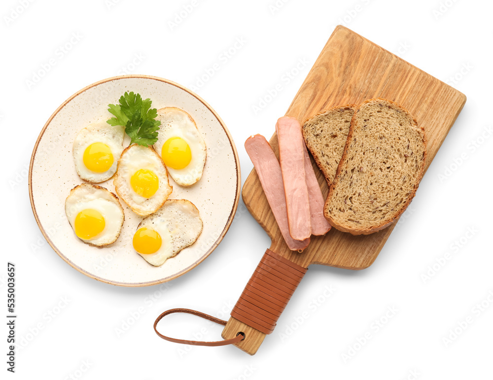 Plate with fried quail eggs, sausages and bread on white background