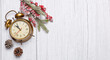 vintage christmas clock on wooden background
