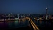 Night drone flight over Düsseldorf Rhine with city lights