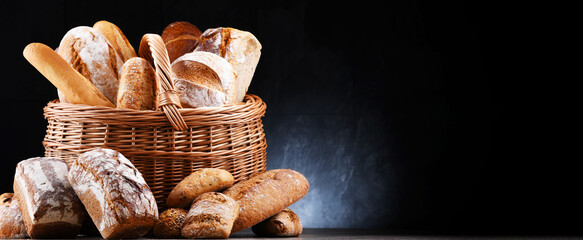 Wall Mural - Wicker basket with assorted bakery products