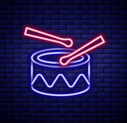 Canvas Print - Glowing neon line Drum with drum sticks icon isolated on brick wall background. Music sign. Musical instrument symbol. Colorful outline concept. Vector