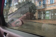 Rain drops on car window. Rainy day from car cabin. Rain drops on car mirror. Travel by auto. Wet car glass. Bad autumn weather. 