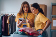 © Zamrznuti tonovi - Couple of female volunteers working in community charity donation center