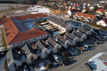 Wall Mural - Winter season in Europe town, aerial view. Residential neighborhood quarters with town houses in european suburban area