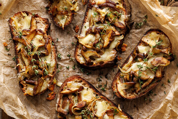 Wall Mural - Sourdough bread toasts with forest mushrooms, mozzarella cheese and thyme, close-up