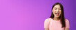 Close-up sincere carefree asian brunette laughing out loud, enjoy comedy movie, having fun, joking friends, stand entertained purple background amused, express positive emotions