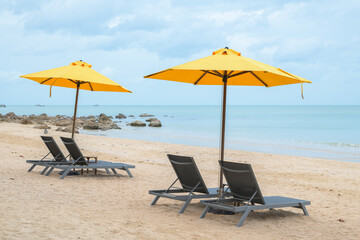 Wall Mural - Beach chair and umbrella on the white sand beach