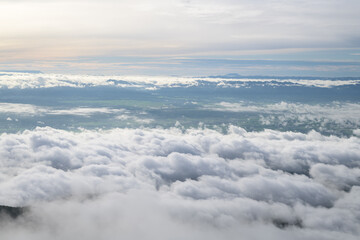 Wall Mural - misty landscape with mountain. foggy clouds above forests.