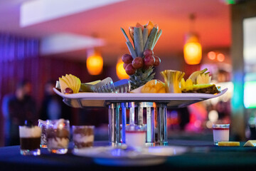 Plate of sliced fruits on a table