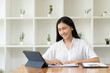 © PaeGAG - Asian woman working with laptop in her office. business financial concept.