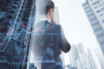 Poster - businessman with creative forex chart with candlestick graph, index and tech hologram on blurry white daylight toning city background. 