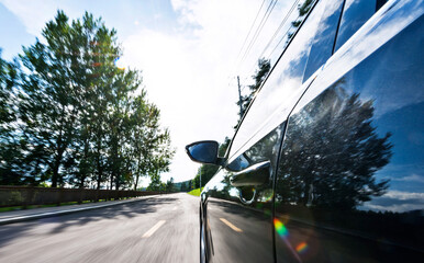 Poster - Mirror view of speeding car with blurred road